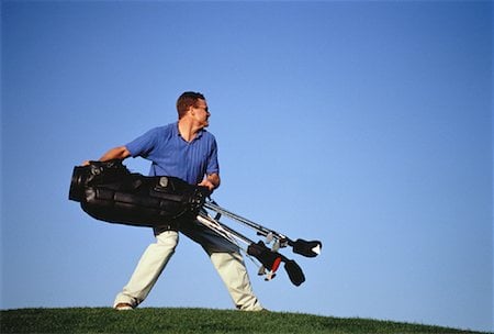 Golfer Throwing Golf Bag Stock Photo - Rights-Managed, Code: 700-00048228