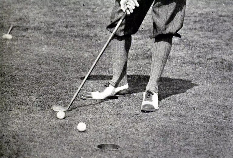 Detail from a photo that appeared in a 1913 golf instruction book by Jerome Travers shows Travers preparing to chip his stymied ball over the stymie his opponent laid for him.
